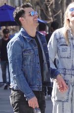 Pregnant SOPHIE TURNER in a Washed Out Denim Jumpsuit Out wioth Joe Jonas in Los Angeles 03/03/2020