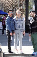 Pregnant SOPHIE TURNER in a Washed Out Denim Jumpsuit Out wioth Joe Jonas in Los Angeles 03/03/2020