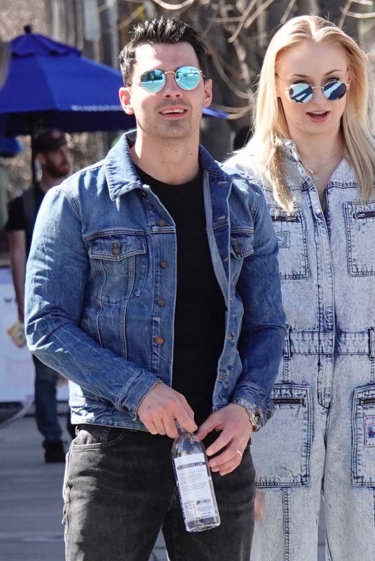 Pregnant SOPHIE TURNER in a Washed Out Denim Jumpsuit Out wioth Joe Jonas in Los Angeles 03/03/2020