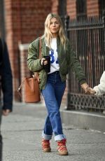 SIENNA MILLER in Denim Shows a Diamond Rring Out in New York 03/11/2020