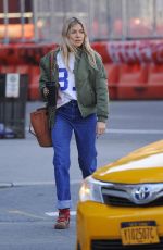 SIENNA MILLER in Denim Shows a Diamond Rring Out in New York 03/11/2020