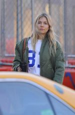 SIENNA MILLER in Denim Shows a Diamond Rring Out in New York 03/11/2020