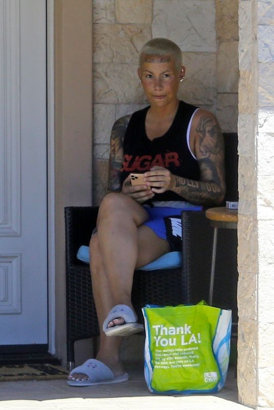 AMBER ROSE and Alexander Edwards in Front of Her Home in Los Angeles 04/25/2020