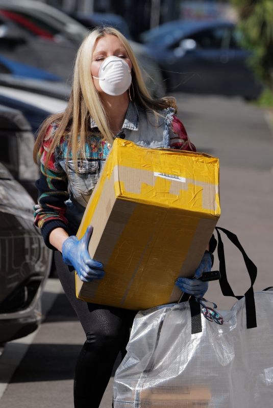 CAPRICE BOURRET Drops off Care Packages for NHS Staff at Hammersmith Hospital in London 04/16/2020