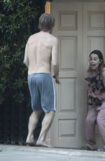 EMILIA CLARKE in Pyjamas with Her Dog Outside Her House in London 04/23/2020