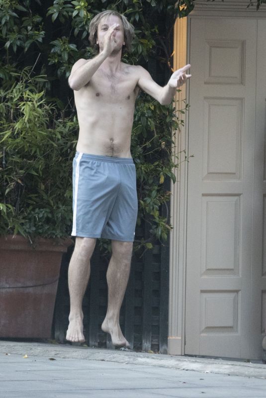 EMILIA CLARKE in Pyjamas with Her Dog Outside Her House in London 04/23/2020