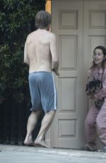 EMILIA CLARKE in Pyjamas with Her Dog Outside Her House in London 04/23/2020