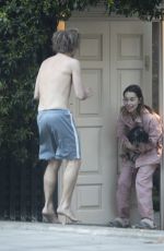 EMILIA CLARKE in Pyjamas with Her Dog Outside Her House in London 04/23/2020