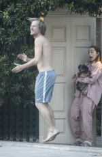 EMILIA CLARKE in Pyjamas with Her Dog Outside Her House in London 04/23/2020