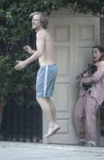 EMILIA CLARKE in Pyjamas with Her Dog Outside Her House in London 04/23/2020