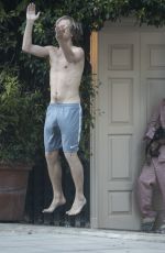EMILIA CLARKE in Pyjamas with Her Dog Outside Her House in London 04/23/2020