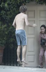 EMILIA CLARKE in Pyjamas with Her Dog Outside Her House in London 04/23/2020