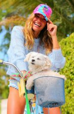 KELLY BENSIMON with Her Dog on a Bike Ride at Her Home in Palm Beach 04/05/2020