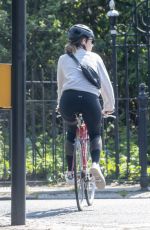 LILY JAMES Riding a Bike Out in London 04/11/2020