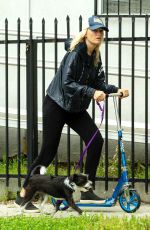 MALIN AKERMAN Rides a Scooter with Her Dog in Los Angeles 04/07/2020