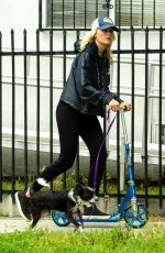 MALIN AKERMAN Rides a Scooter with Her Dog in Los Angeles 04/07/2020