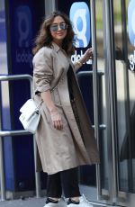 MYLEENE KLASS in a Trench Coat Arrives at Smooth Radio in London 04/04/2020