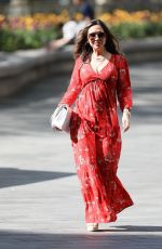 MYLEENE KLASS in Red Maxi Dress Arrives at Smooth Radio in London 04/25/2020