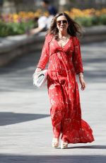 MYLEENE KLASS in Red Maxi Dress Arrives at Smooth Radio in London 04/25/2020