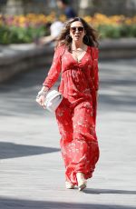 MYLEENE KLASS in Red Maxi Dress Arrives at Smooth Radio in London 04/25/2020