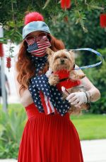 PHOEBE PRICE in a Red Dress Out with Her Dog 04/18/2020