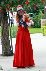 PHOEBE PRICE in a Red Dress Out with Her Dog 04/18/2020