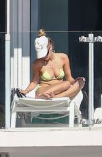 ROOSMARIJN DE KOK in Bikini Ssunbathing on Her Balcony in Miami 04/02/2020