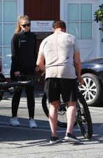CHRISTINA SCHWARZENEGGER Helps Her Father Aarnold Loading a Bike 05/19/2020