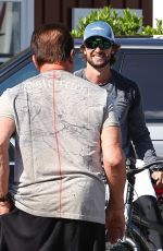CHRISTINA SCHWARZENEGGER Helps Her Father Aarnold Loading a Bike 05/19/2020