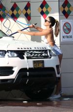 CJ FRANCO in Denim SHorts and Bikini Top Out Washing Her Car in Santa Monica 05/02/2020