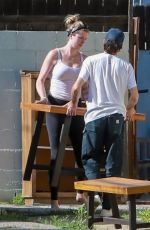 IRELAND BALDWIN Offloading a Table and Chairs from Her Truck in Los Angeles 05/22/2020