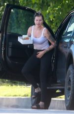 IRELAND BALDWIN Offloading a Table and Chairs from Her Truck in Los Angeles 05/22/2020