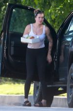 IRELAND BALDWIN Offloading a Table and Chairs from Her Truck in Los Angeles 05/22/2020