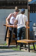 IRELAND BALDWIN Offloading a Table and Chairs from Her Truck in Los Angeles 05/22/2020