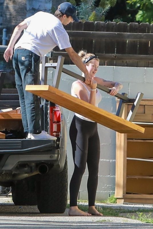 IRELAND BALDWIN Offloading a Table and Chairs from Her Truck in Los Angeles 05/22/2020