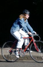 LILY JAMES Out Riding a Bike in London 05/15/2020