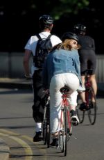 LILY JAMES Out Riding a Bike in London 05/15/2020