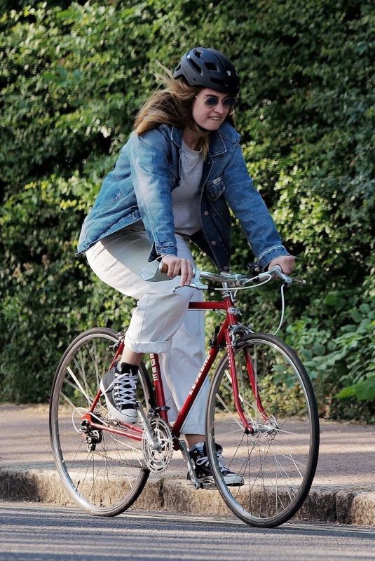 LILY JAMES Out Riding a Bike in London 05/15/2020