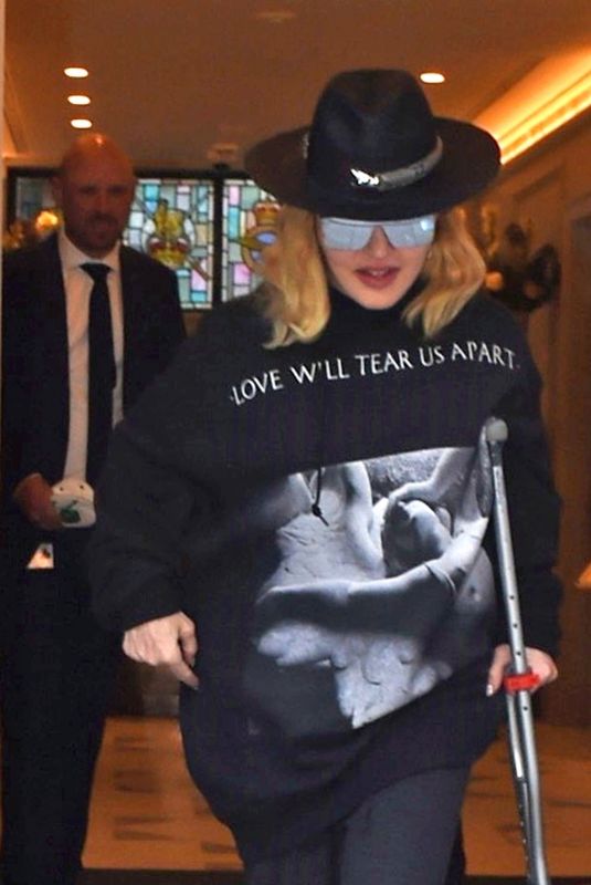 MADONNA Leaving a Hospital Supported by a Crutch in London 05/29/2020