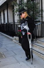 MADONNA Leaving a Hospital Supported by a Crutch in London 05/29/2020