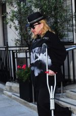 MADONNA Leaving a Hospital Supported by a Crutch in London 05/29/2020