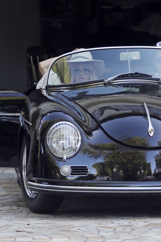 RACHEL ZOE and Rodger Berman Cruise in a Vintage Porsche Roadster 05/24/2020