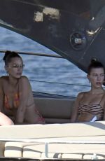 BELLA HADID and HAILEY BIEBER in Bikins at a Boat in Italy 06/23/2020