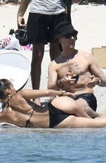 BELLA HADID in Bikini on the Set of a Photoshoot at a Beach 06/24/2020