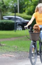 DEVON WINDSOR Out Riding a Bike with Her Dog in Miami 06/06/2020