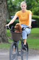 DEVON WINDSOR Out Riding a Bike with Her Dog in Miami 06/06/2020