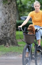 DEVON WINDSOR Out Riding a Bike with Her Dog in Miami 06/06/2020