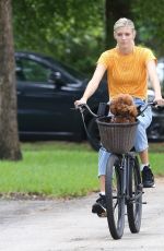 DEVON WINDSOR Out Riding a Bike with Her Dog in Miami 06/06/2020