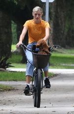DEVON WINDSOR Out Riding a Bike with Her Dog in Miami 06/06/2020