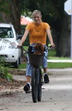 DEVON WINDSOR Out Riding a Bike with Her Dog in Miami 06/06/2020